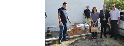 Imagem: Servidores entregam donativos na SEADES